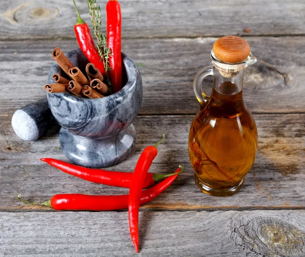 Still-life of spice and mortar on a old wooden table — Stock Photo, Image