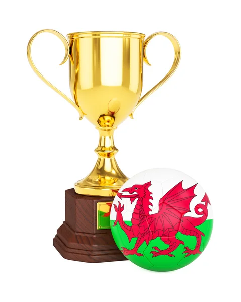 Arany trófeát kupa és a foci futball labda walesi zászló — Stock Fotó