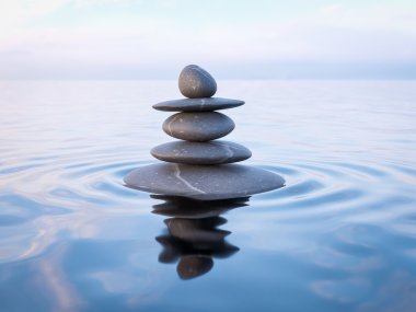 Balanced Zen stones in water