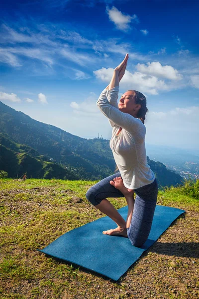 Woman doing Ashtanga Vinyasa yoga advanced asana — Stock Photo, Image