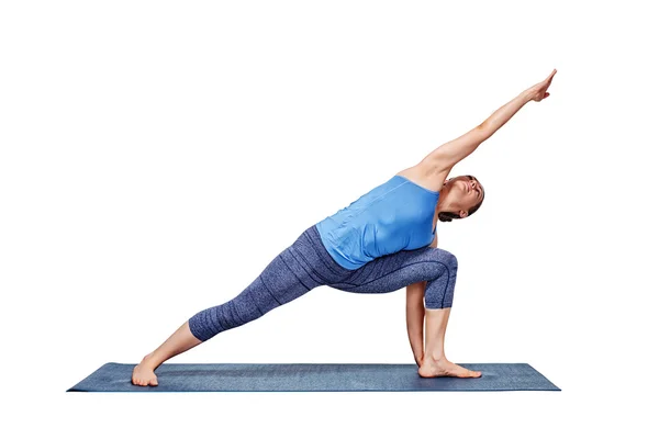 Woman doing Ashtanga Vinyasa Yoga asana Utthita parsvakonasana — Stock Photo, Image