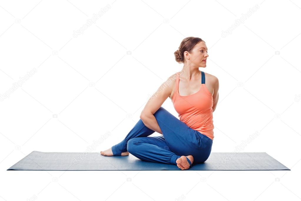 Woman doing Ashtanga Vinyasa Yoga asana  Marichyasana D