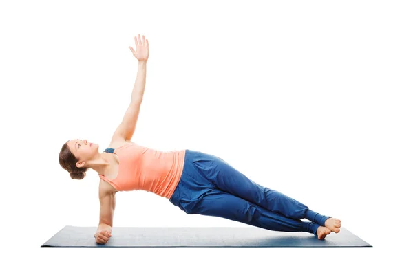 Woman doing yoga asana Vasisthasana - side plank pose — стокове фото