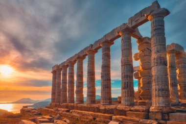 Poseidon temple ruins on Cape Sounio on sunset, Greece clipart