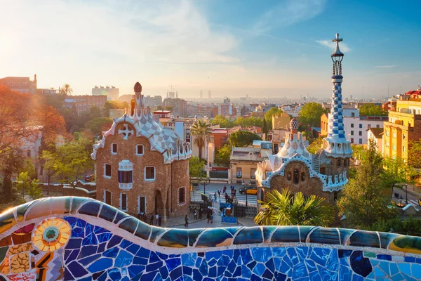 Barcelona city view from Guell Park. Sunrise view of colorful mosaic building in Park Guell — Stock Photo, Image