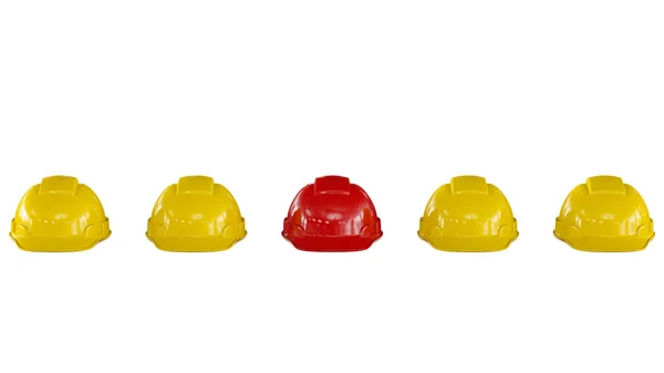 Linha de capacetes de segurança amarelo com um vermelho — Fotografia de Stock