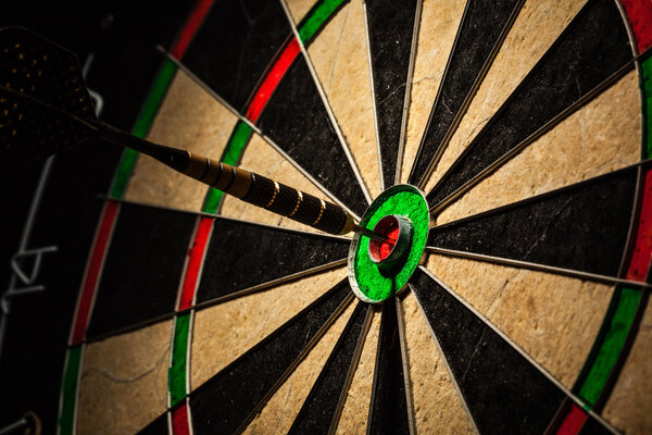 Dart in bulls eye close up