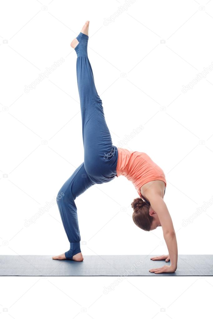 Beautiful sporty fit yogi girl practices yoga asana eka pada cha