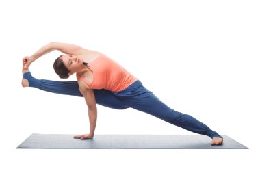 Beautiful sporty fit yogi girl practices yoga asana visvamitrasa