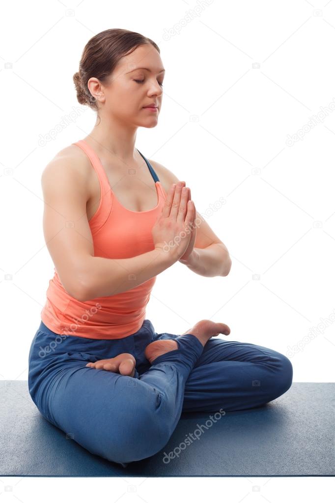 Beautiful sporty fit yogini woman meditates in Padmasana asana l