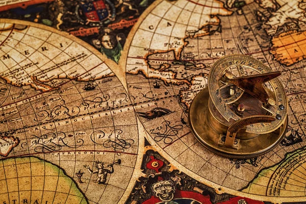 Old vintage compass on ancient map