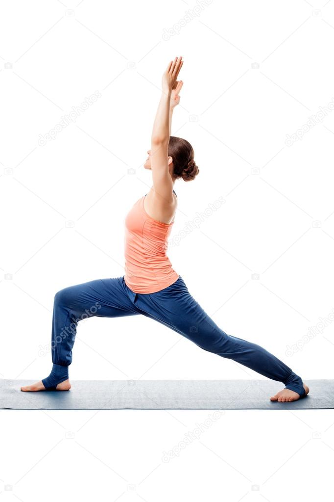 Sporty woman practices yoga asana