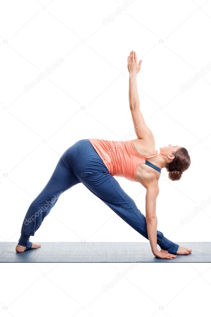 Sporty woman practices Ashtanga Vinyasa yoga asana