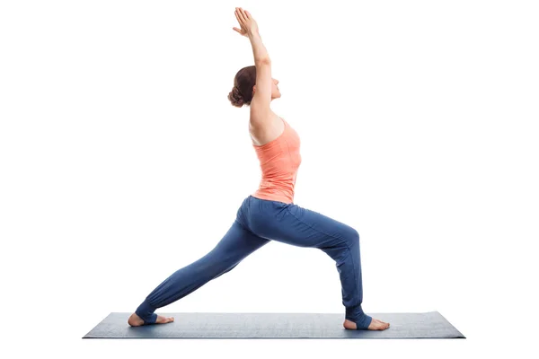 Woman practices yoga asana utthita Virabhadras — Stock Photo, Image