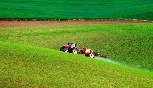 Farm machinery spraying insecticide