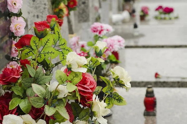 Artificial flowers at the cemetery — Stock Image Artificial flowers at the cemetery Royalty Free Stock Photos