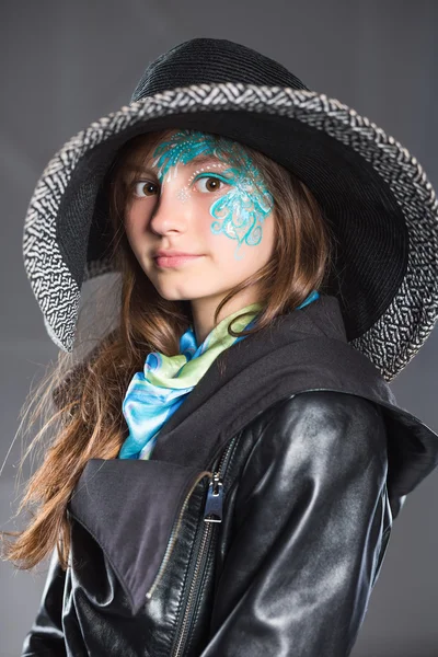 Young girl in black hat and jacket — Stock Photo, Image