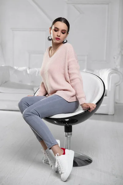 Charming Brunette Dressed Pink Pullover Jeans Sitting Armchair — Stock Photo, Image