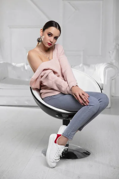 Lovely Brunette Dressed Pink Pullover Jeans Sitting Armchair — Stock Photo, Image