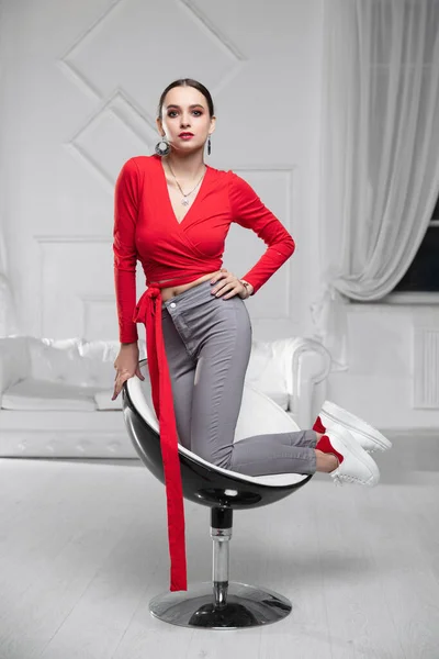 Nice Woman Wearing Red Blouse Jeans Posing Studio Fotos De Bancos De Imagens Sem Royalties