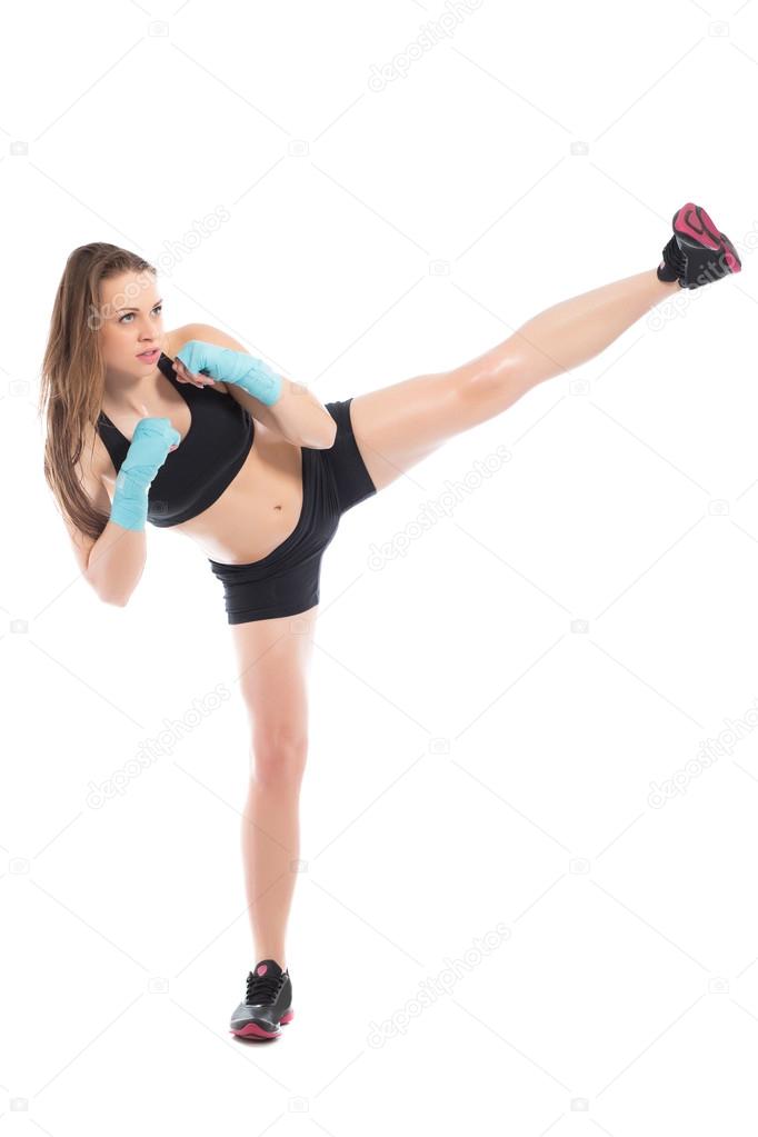 Woman posing and kicking