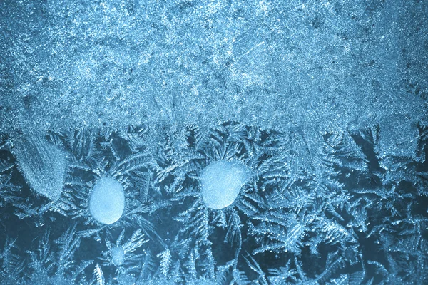 Frostiga bakgrundsmönster på glas — Stockfoto