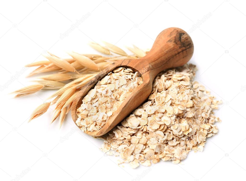 Oat porridge with oat plant isolated on white backgrounds. Uncooked oat flakes.