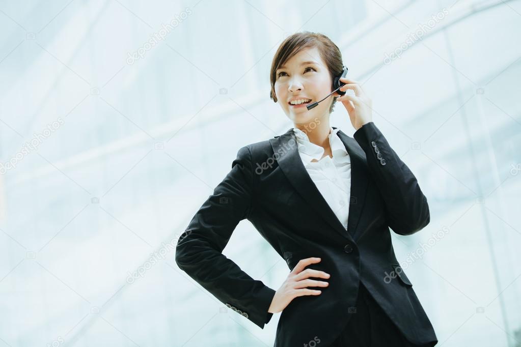 Asian businesswoman with headphones