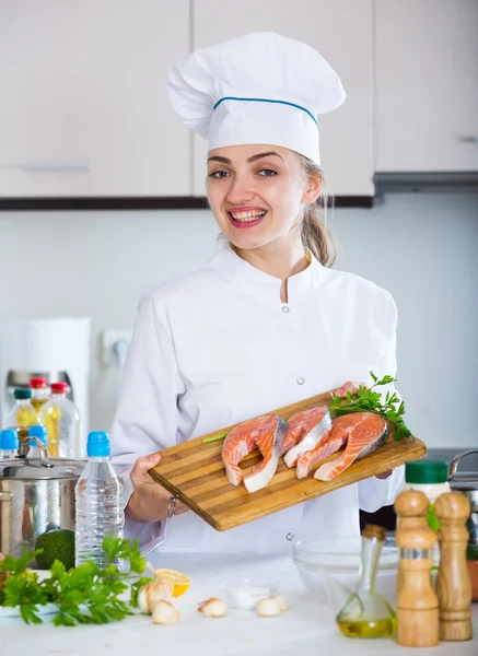 Chef preparing trout in kitchen — Stock Photo, Image