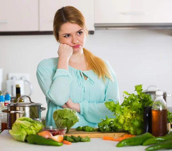 Woman with rotten vegetables at home — Stock Photo, Image