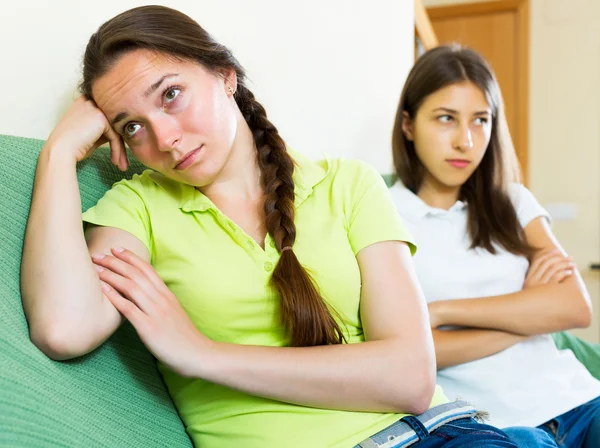 Woman friends sitting and discontent — Stock Photo, Image