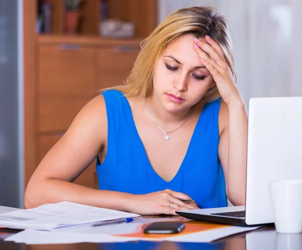 Exhausted young woman at office — Stock Photo, Image