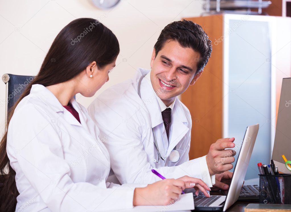 Family doctors with stethoscope — Stock Photo © Jim_Filim 108459000