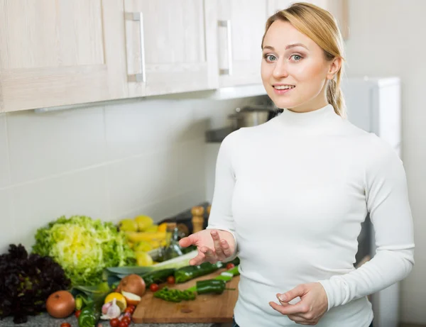 Happy woman with assortment of vegetables — Stock Photo, Image