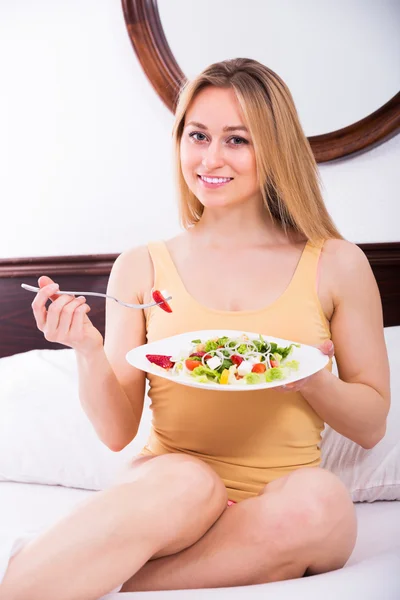 Woman in lingerie having salad — Stock Photo, Image