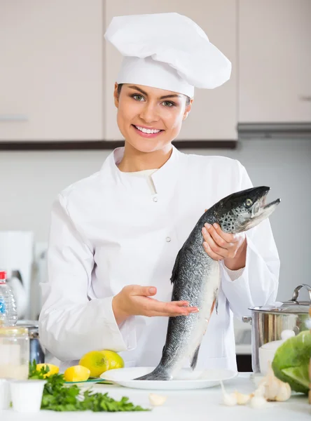 Chef holding uncooked  fish — Stock Photo, Image