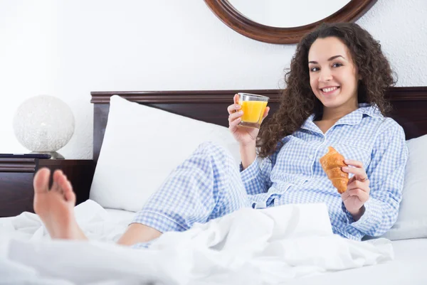 Female brunette with pastry — Stock Photo, Image