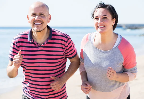 Running mature couple — Stock Photo, Image