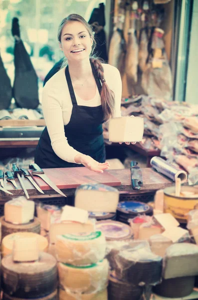 Brunette with different types of cheese — Stock Photo, Image