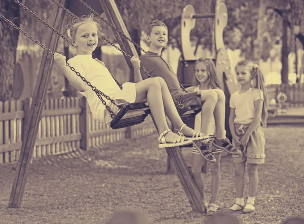 View on children swinging — Stock Photo, Image