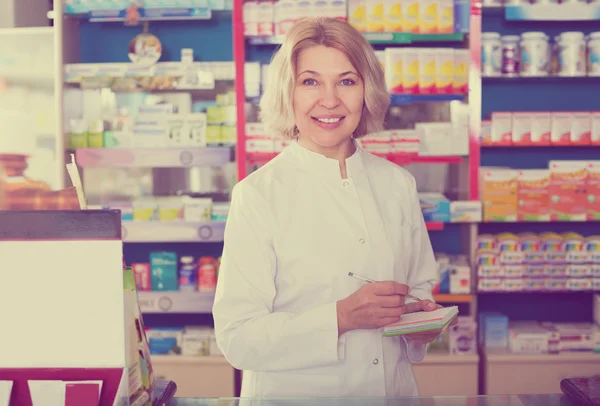 Female near counter in pharmacy — Stock Photo, Image