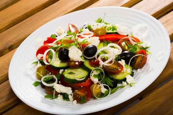 Sopska salad with fresh tomato, onion, cucumber and brynza cheese Stock Picture