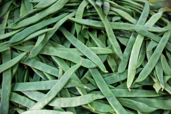 Ripe beans on a market counter — Stock Photo, Image