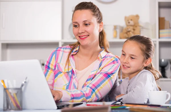 Smiling schoolgirl and young mother — Stock Photo, Image