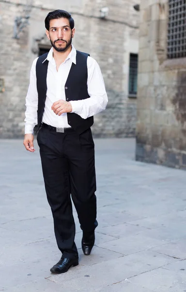 Man walking along old town street — Stock Photo, Image