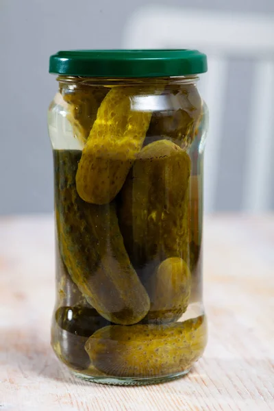 Marinated cucumbers in glass jar — Stock Photo, Image