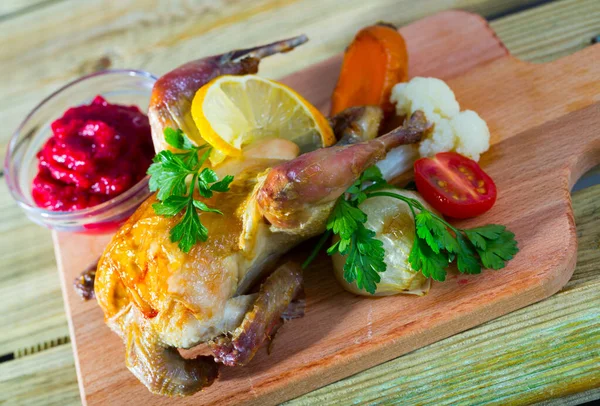 Roasted partridge with cranberry sauce — Stock Photo, Image