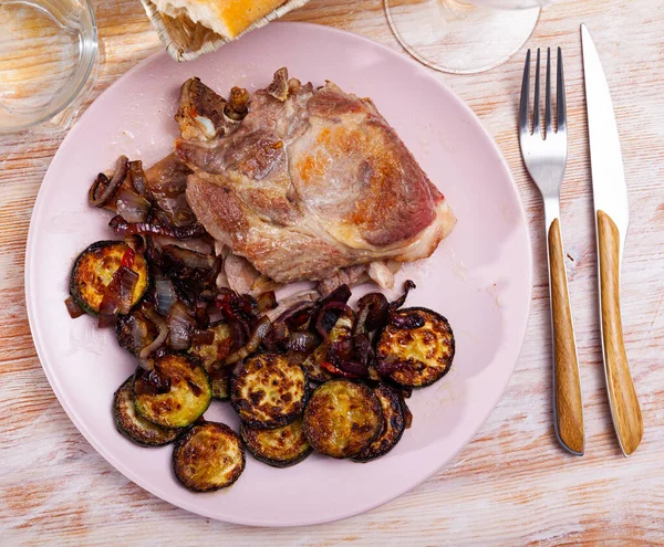 Roasted pork chop with zucchini — Stock Photo, Image