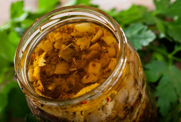 Marinated herring with onions and spice in a glass jar — Stock Photo, Image