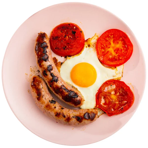 Huevos fritos con tomates y salchichas para el desayuno —  Fotos de Stock